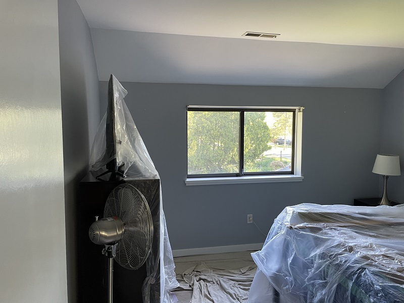 Brown aluminum windows make the house look dark